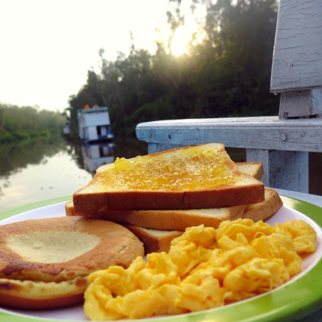A hearty breakfast spread of toast and eggs served fresh on the deck.